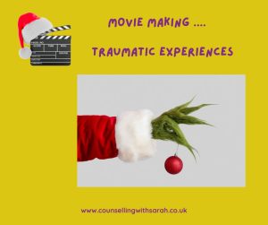 Image shows the Grinch's arm holding a decoration with the wording 'movie making... traumatic experiences'